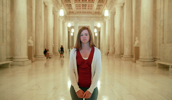 Abigail Fisher, 22, stands in the Great Hallway of the U.S. Supreme Court. © Fred R. Conrad/The New York Times 
