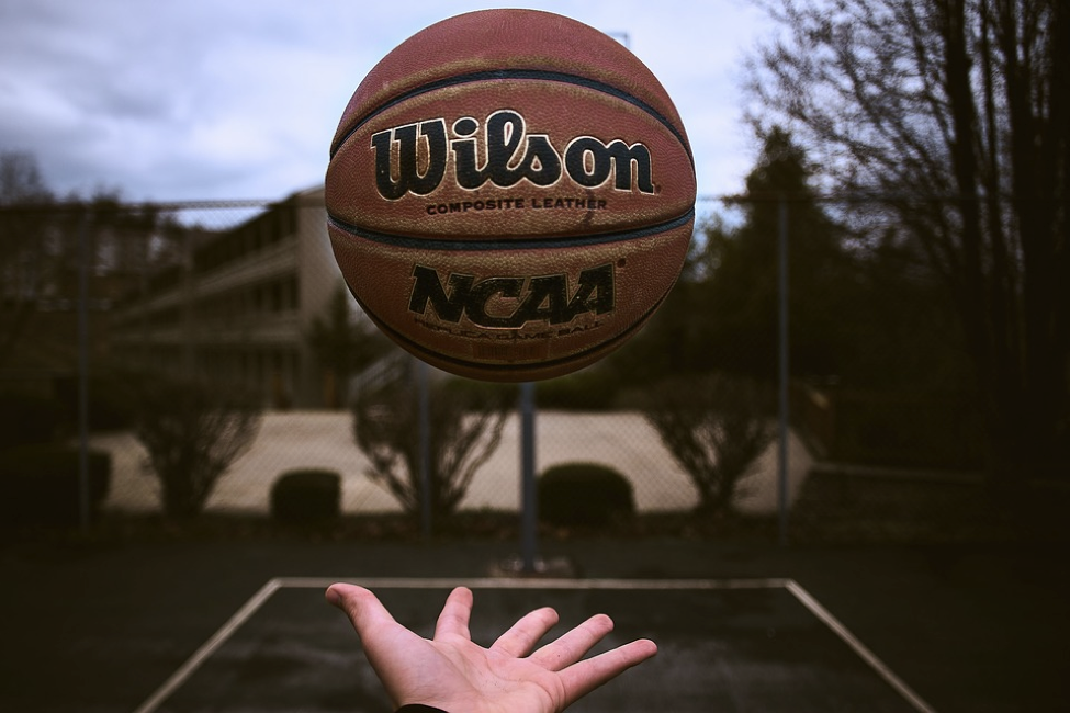 Image of a basketball in the air